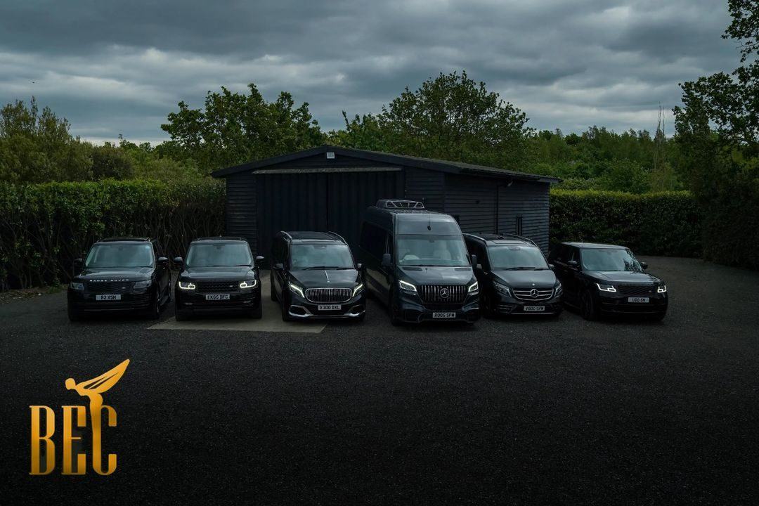 Bedford Executive Cars fleet of six vehicles lined up at the yard — corporate chauffeur Bedford Executive Cars