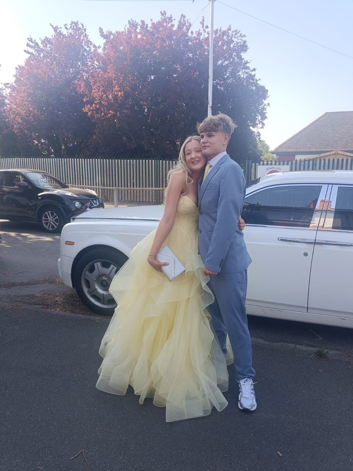Prom couple with Rolls-Royce Phantom outside school — Bedford Executive Cars