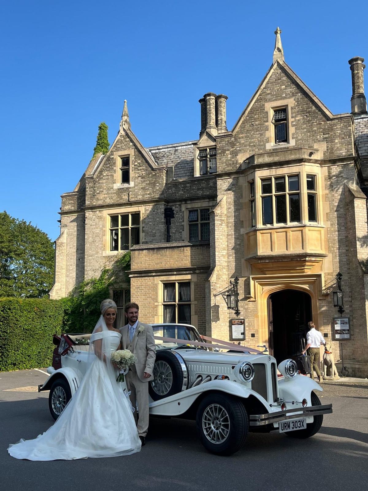 Bride and groom with Beauford at Gothic manor — Bedford Executive Cars